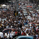 People evacuated from office buildings gather in Reforma Avenue after an earthquake in Mexico City. (Image: AP)